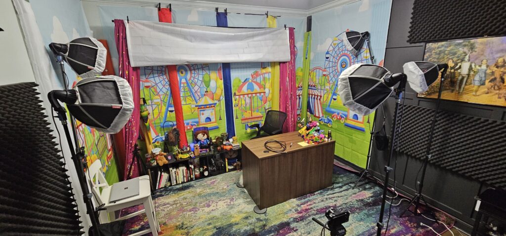 Richard Wilmore's show set: a desk with a colorful circus background